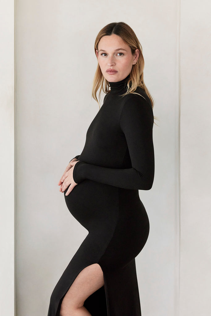 The Bumpsuit Maternity The Monica Turtleneck High Slit Maxi Dress in Black